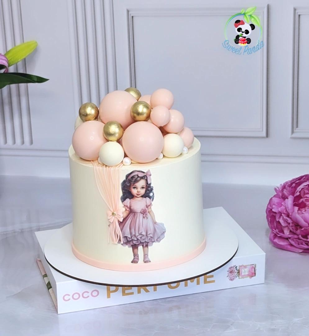 Single-tier celebration cake with cream fondant featuring a vintage girl illustration