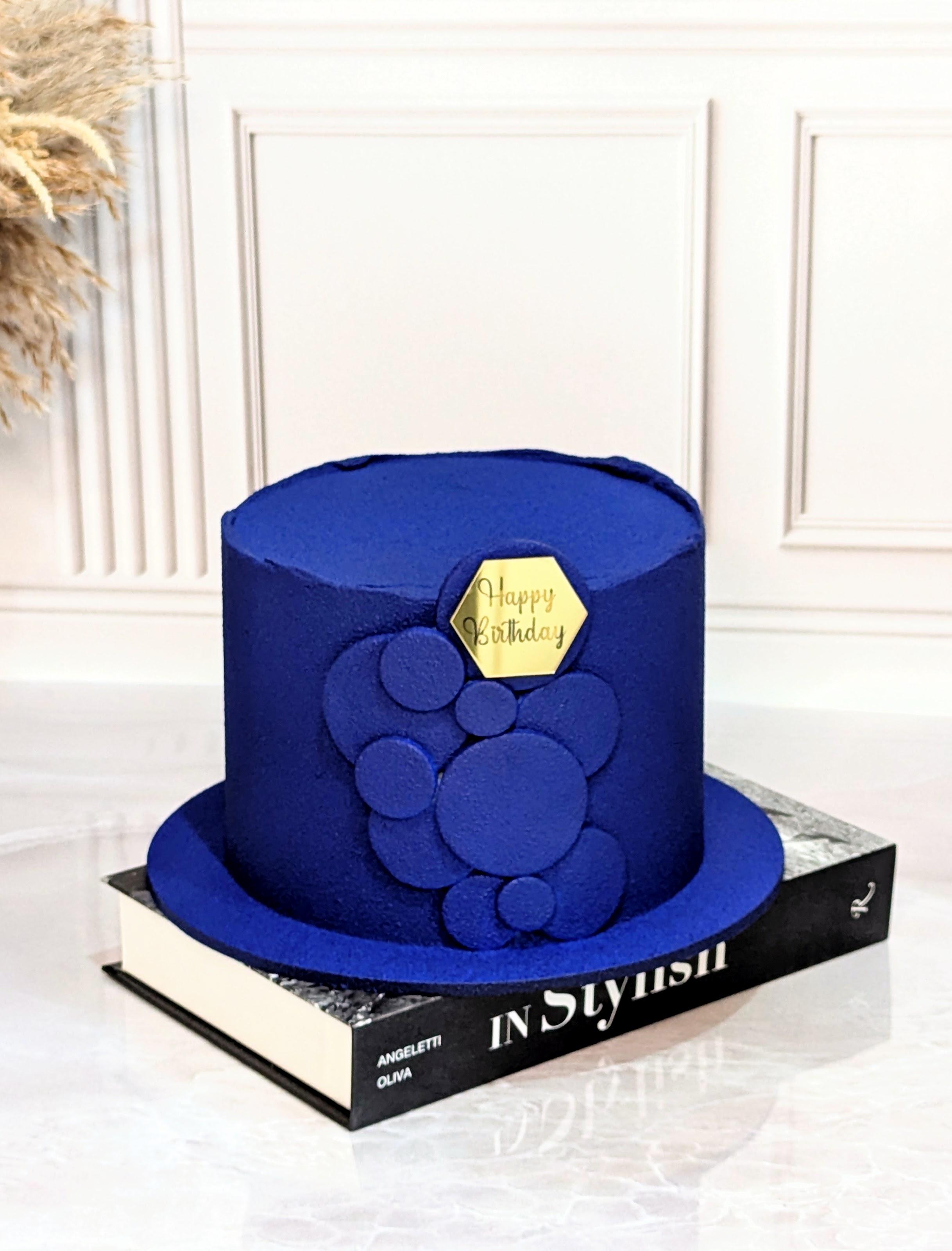 Single-tier round cake with royal blue fondant finish