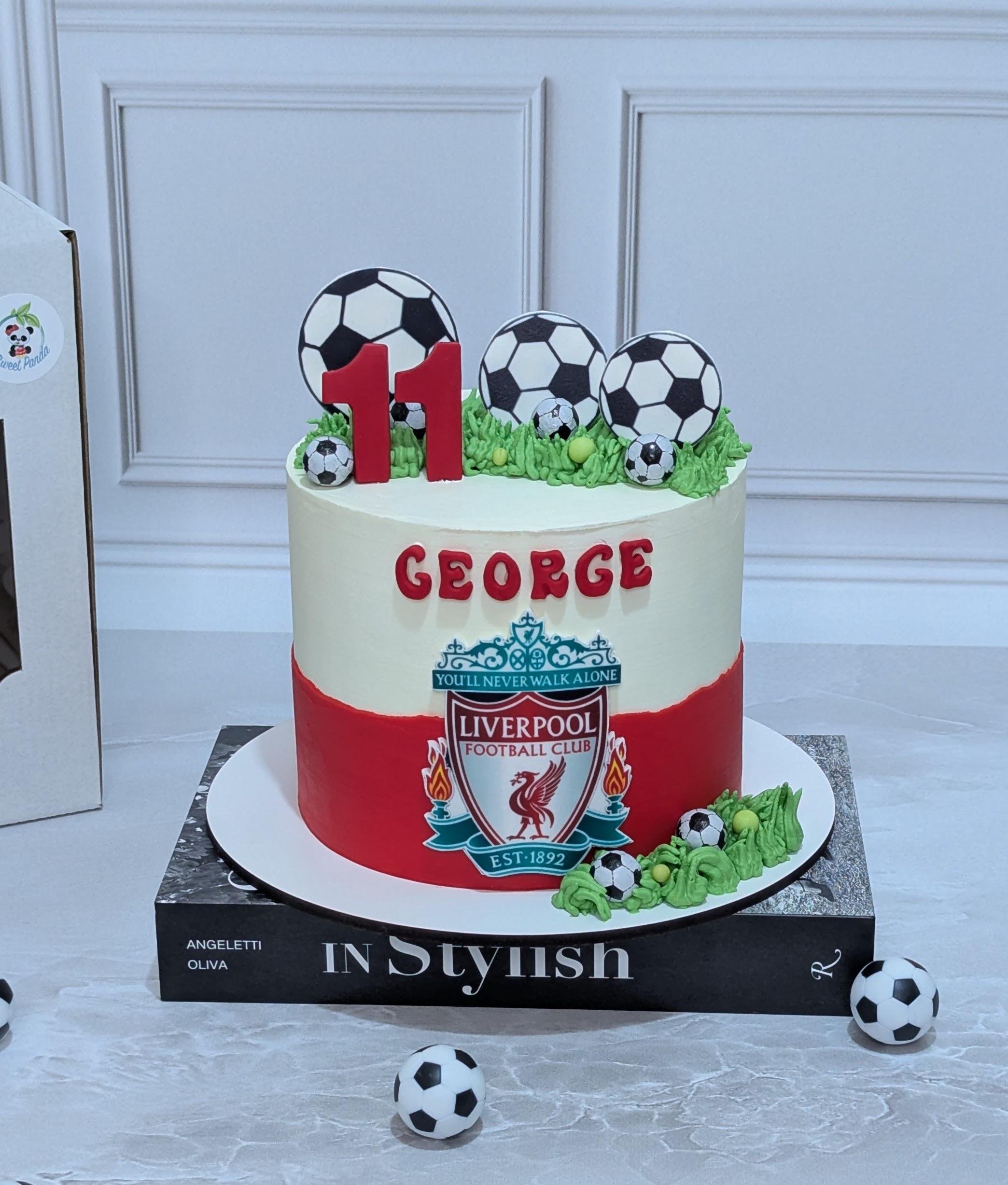 Red and white fondant cake with Liverpool Football Club crest, number 11 topper